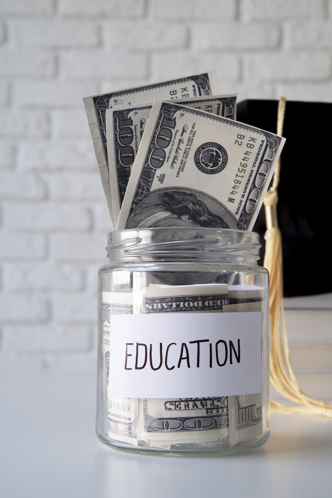 Jar labeled Education filled with savings